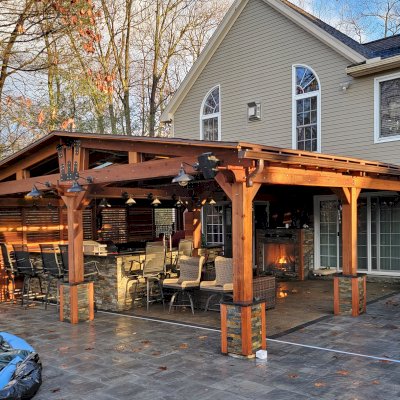 Forever Porch Pavilion (Options: 25'-6" L x 26' W, California Redwood, 8-Post Anchor Kit for High-Wind, No Electrical Wiring Trim, 8.5 ft Posts Height, 1 Privacy Wall with Mobile Louvers, No Post Decorative Trims, No Ceiling Fan Base, No Curtain Rods, Transparent Premium Sealant). Photo Courtesy of R. Robinson of Windham, NH.